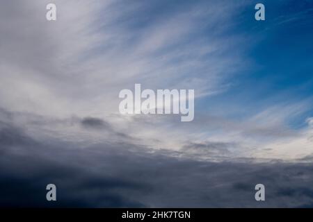 Blue sky shrouded in gray dark clouds Stock Photo