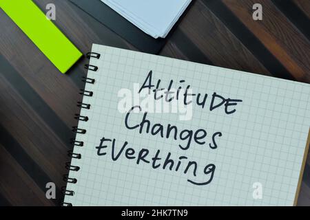 Attitude Changes Everything write on a book isolated on Wooden Table. Stock Photo