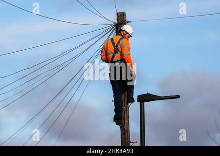 A network engineer from Openreach, a unit of BT Group Plc at the top of ...