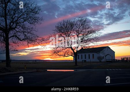 The chapel of Fort Hancock at Sandy Hook, New Jersey, during a colorful sunset after a rain storm Stock Photo