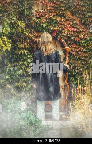 Alchemist in a beautiful ornamental dress in nature. Stock Photo