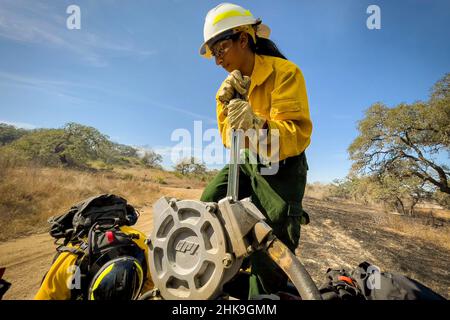 January 19, 2020 - Joint Base San Antonio-Camp Bull, Texas, USA - Nesa Yoko Rampernas, Air Force Wildland Fire Branch firefighter, along with Joint Base San Antonio's Natural Resources Office, and Fire & Emergency Services conduct a prescribed burn, Jan. 19, 2022, at Joint Base San Antonio-Camp Bullis, Texas. The process will focus on more than 1,700 acres of wildlands on JBSA-Camp Bullis from Jan. 18-26. The burn is intended to reduce fuel loads, such as dead vegetation and thick brush, which will lessen the risk of future, potentially catastrophic, wildfires. Joint Base San Antonio Fire Em Stock Photo