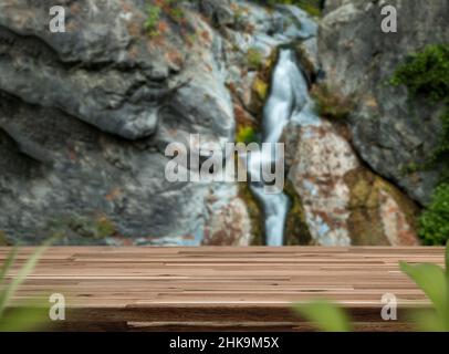 Close up photo of blurred fresh waterfall or water sources on the background and empty tabletop for product montage and display. Stock Photo