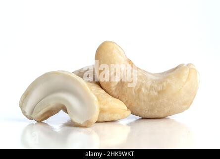 Macro photo of raw cashews on isolated white background. Stock Photo