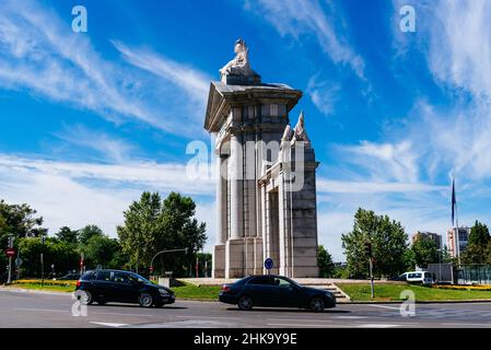 Madrid, Spain - July 3, 2021: Puerta of San Vicente. Monumental gate in central Madrid. with traffic a sunny day of summer Stock Photo