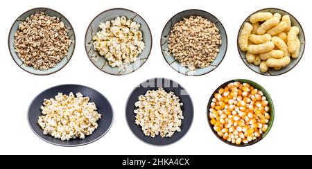 set of various popcorns and flakes in ceramic bowls isolated on white background Stock Photo