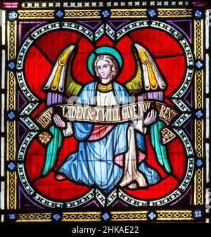 Stained glass window Pakenham church, Suffolk, England, UK c 1862 William Wailes detail of winged angel Stock Photo