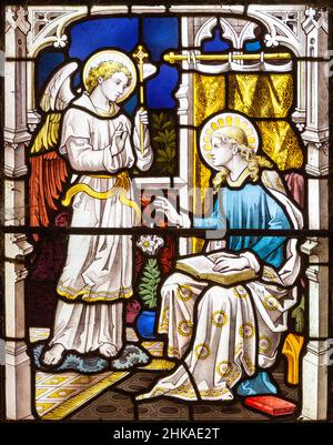 Stained glass window Pakenham church, Suffolk, England, UK c 1887 looks Heaton, Butler and Baynes detail Annunciation Stock Photo