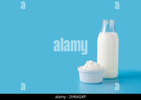 Milk kefir drink on blue background.Liquid and fermented milk product on blue background Stock Photo
