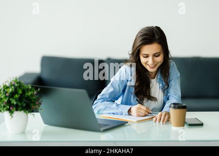 Close up focused young businesswoman working with documents in office Stock Photo