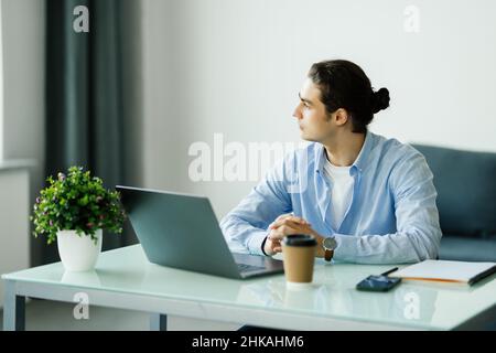 Young man working on laptop Stock Photo