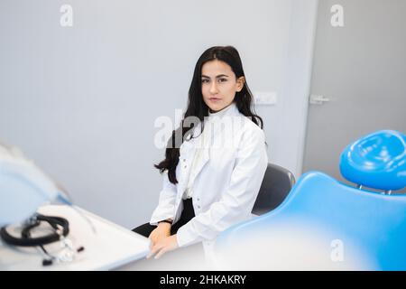 Portrait of young female dentist in office Stock Photo