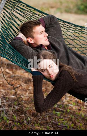 Young couple laying in hammock Stock Photo