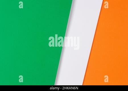 Green, white and orange color paper background with copy space. Abstract geometric composition paperboard with copy space Stock Photo