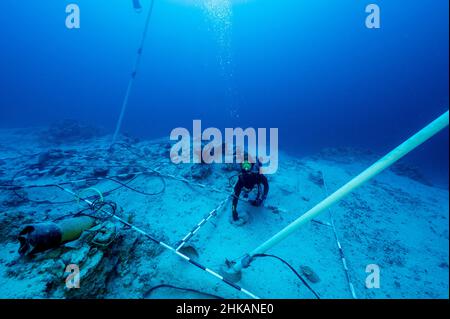Underwater archaeologists digging BC 2nd century shipwreck in Bozburun Marmaris Turkey.