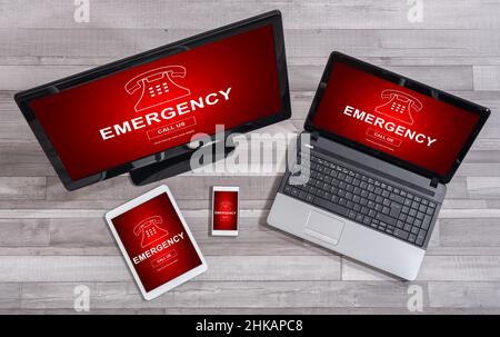 Emergency concept shown on different information technology devices Stock Photo