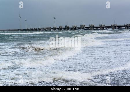 A closed barrier section of the Oosterscheldekering (Eastern Scheldt storm surge barrier) during storm Corrie on January 31 2022. Zeeland, Netherlands Stock Photo