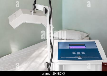 Close-up detail view of physiotherapy medical diathermy treatment equipment. Microwave therapy room with couch. Physical rehabilitation service device Stock Photo
