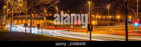 Light trails on a street in the evening Stock Photo