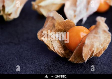 physalis fruit close up on dark background Stock Photo