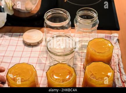 Making fresh homemade orange jam in the kitchen Stock Photo