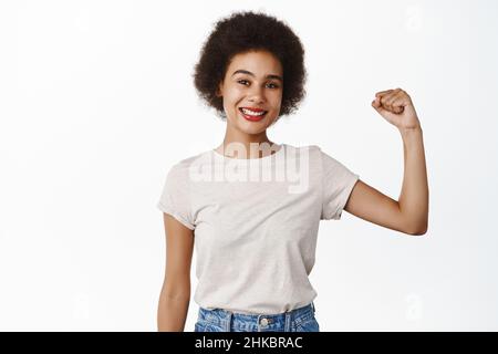 African woman flexing biceps Stock Photo - Alamy