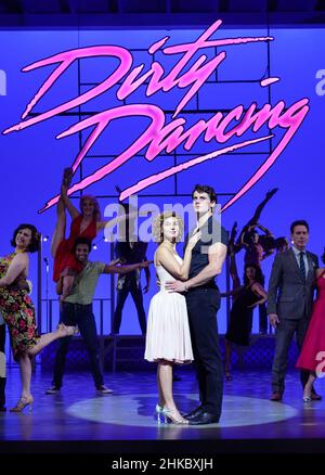 Michael O'Reilly, as Johnny Castle, and Kira Malou, as Frances 'Baby' Houseman with the cast of Dirty Dancing - The Classic Story on Stage during a photocall at the Dominion Theatre, London, as the show returns to the West End. Picture date: Thursday February 3, 2022. Stock Photo