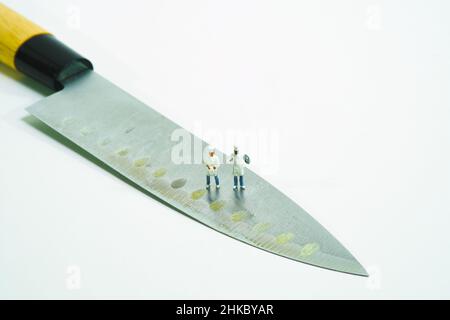 chefs standing on a kitchen knife Stock Photo