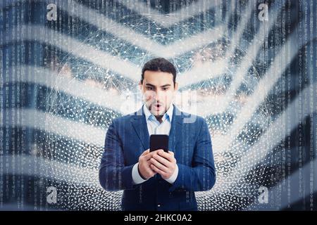 Amazed businessman using his smartphone browsing cyberspace. New web performance, engaging network experience, metaverse concept. Modern technology fo Stock Photo