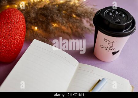 Cup of coffee and open notebook on table. High quality photo Stock Photo