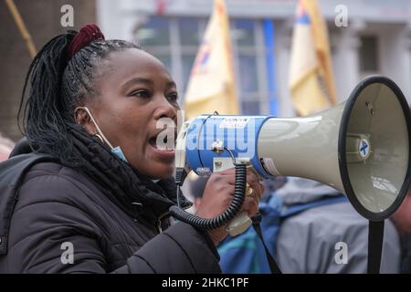 London, UK, 3rd Feb 2022. A woman speaks about her work problems because of outsourcing when whe was prgnat at the rally supporting security guards at Great Ormond Street Hospital on a six-week strike for equality and against race discrimination. They largely Black, brown and migrant workers are outsourced and are demanding similar sick pay, annual leave and overtime pay to the largely white workers directly employed by the hospital. Both their employer and the hospital have refused to negotiate. Peter Marshall/Alamy Live News Stock Photo