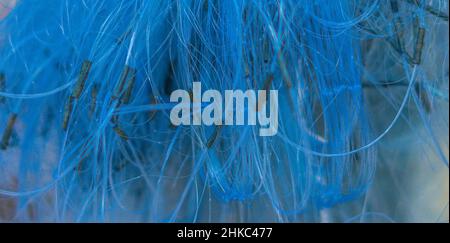 BANNER Abstract real photo bright blue background. Close sail sea fishing tangled line airy mesh texture. Geometric waves circles threads unusual Stock Photo