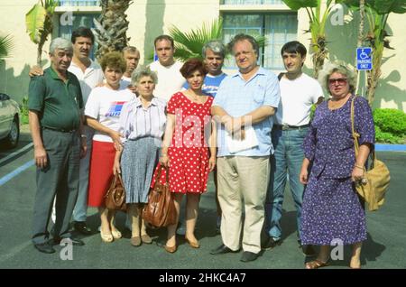Los Angeles, CA, USA, 1994. Group of Romanians visiting the United States for the FIFA World Cup. Third from left, Romanian-American journalist Aristide Buhoiu. Second from left, journalist Gheorghe Voicu (Evenimentul Zilei). First and fifth from right, the parents of the famous Romanian soccer player Gheorghe Hagi. Stock Photo