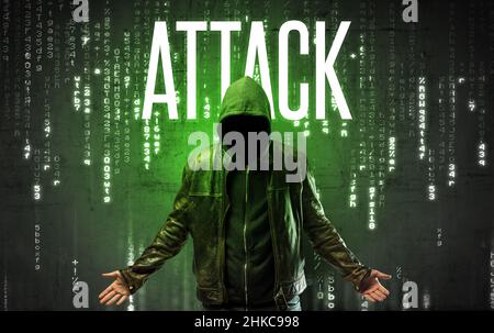 Faceless hacker with inscription Stock Photo