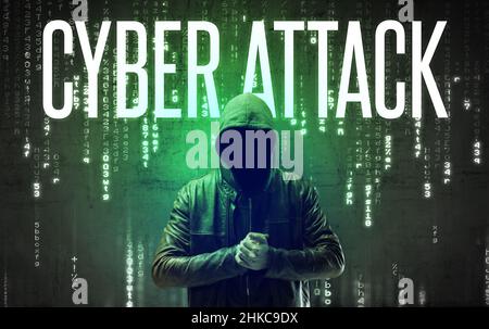 Faceless hacker with inscription Stock Photo