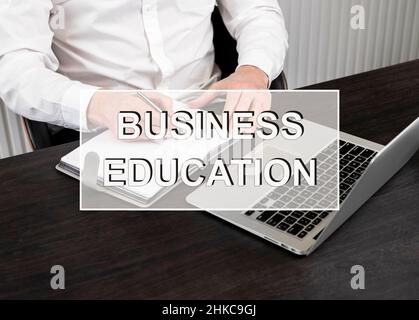 Business education concept. Text on photo with laptop and businessman studying. High quality photo Stock Photo