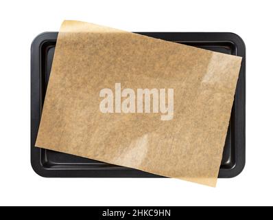 Baking sheet with brown parchment paper isolated on white background. Empty oven tray for baking and roasting. Rectangular baking pan for food design. Stock Photo