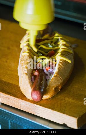 Hotdogs in making. Close up. Stock Photo