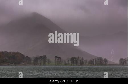 A day of heavy rain in Buttermere in the English Lake District, with the surrounding fells covered by mist and low clouds Stock Photo
