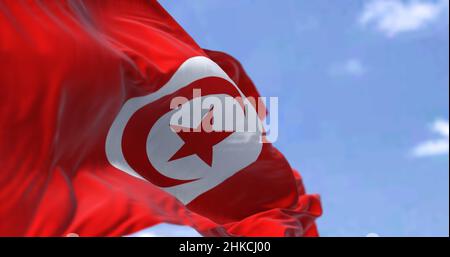 Detail of the national flag of Tunisia waving in the wind on a clear day. Democracy and politics. Patriotism. Maghreb country in north Africa. Selecti Stock Photo