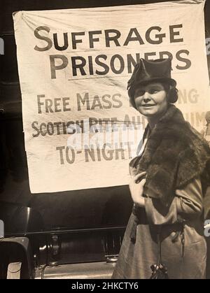 Lucy Branham, American Suffragist, standing in front of banner, 'Suffrage Prisoners', National Woman's Party, March 1919 Stock Photo