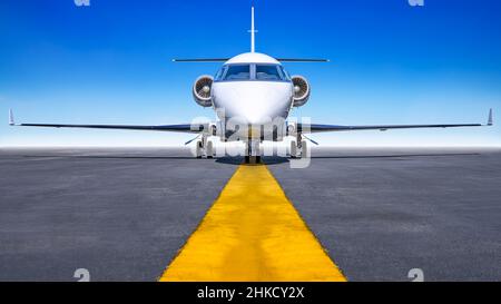 private jet on a runway ready for take off Stock Photo