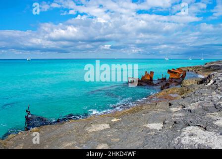 The Gallant Lady shipwreck on the rocky coast of North Bimini island, Bahamas on a sunny day with clear blue water. Stock Photo