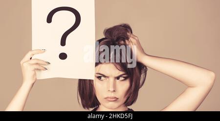 Thinking woman. Concept - challenging issue, looking for the answer. Isolated girl. Woman with doubtful expression and question marks. Question mark Stock Photo