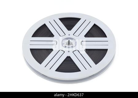 old 8mm cine film and reel; isolated on white (clippin path Stock