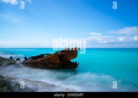 A long exposure shot of waves breaking around the bow and hull of The Gallant Lady shipwreck, North Bimini, Bahamas Stock Photo