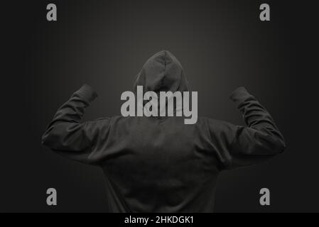 Hoodie black color with hands up template mock up on black background Stock Photo