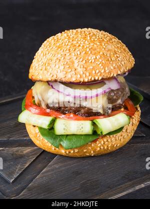 fresh burger with veal cutlet on a wooden background Stock Photo