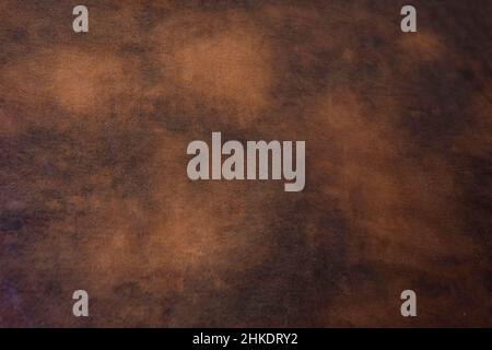 Faux brown leather background with different tones of brown. Stock Photo