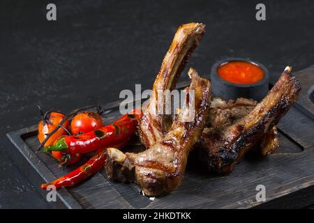 lamb square with hot pepper on a wooden board Stock Photo